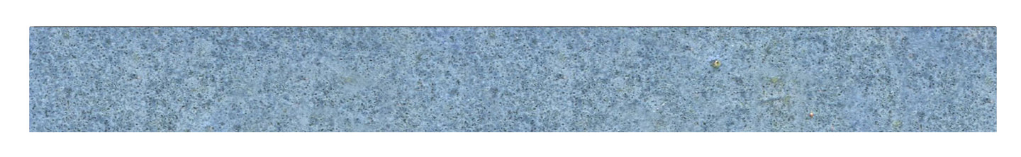 A single line of mottled blue ceramic tile trim.